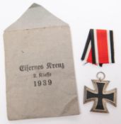 A good Third Reich Iron Cross 2nd class in its paper envelope of issue, dated 1939, complete with