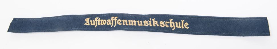 A Third Reich cuff title, blue with cream lettering "Luftwaffen Musikschule". GC £80-100