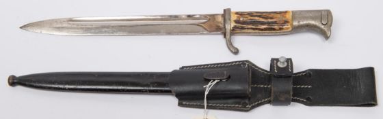 A Third Reich parade bayonet, staghorn grip on plated hilt, blade 9½" marked "WKC", GC £70-80