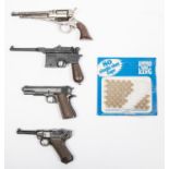 Four percussion cap firing miniature pistols: Luger, 1896 Mauser automatic, 1911 Colt Automatic, and