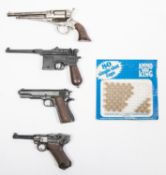 Four percussion cap firing miniature pistols: Luger, 1896 Mauser automatic, 1911 Colt Automatic, and
