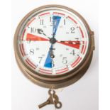 A brass bodied bulkhead/ship's clock, by Sestrel, white enamelled face numbered 1017 and with