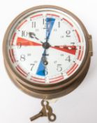 A brass bodied bulkhead/ship's clock, by Sestrel, white enamelled face numbered 1017 and with