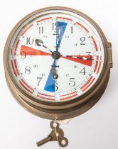 A brass bodied bulkhead/ship's clock, by Sestrel, white enamelled face numbered 1017 and with