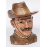A painted earthenware tobacco jar, in the form of the head and shoulders of a Boer War period City