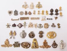 A small quantity of military cap and collar badges etc, cap badges include small size QVC Royal