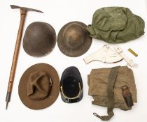 A military Alpenstock, 2 kit bags, a white revolver holster, 2 bayonet frogs, 2 steel helmets (no