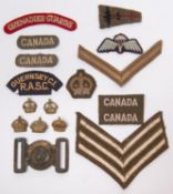 A small quantity of cloth items etc: Guernsey CI RASC title; pair of cream on khaki "CANADA" titles;