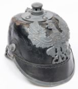 A WWII Prussian pickelhaube, with grey painted brass badge (sceptre missing) and steel mounts.