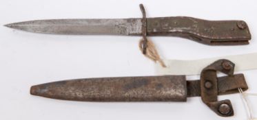 A WWI trench knife bayonet, 6" blade marked "Demag Duisburg" and "Gesetzlich Geschutz", in its