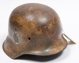 The skull only of a German M42 steel helmet, with traces of camouflage finish and single mostly