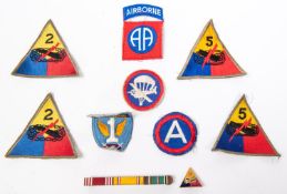 8 WWII or later US Army Divisional patches, a 2nd Armoured enamelled badge and ribbon bar. GC £40-50