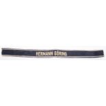 A Third Reich Hermann Goring cuff title, white embroidery border on black, cream lettering. GC £60-