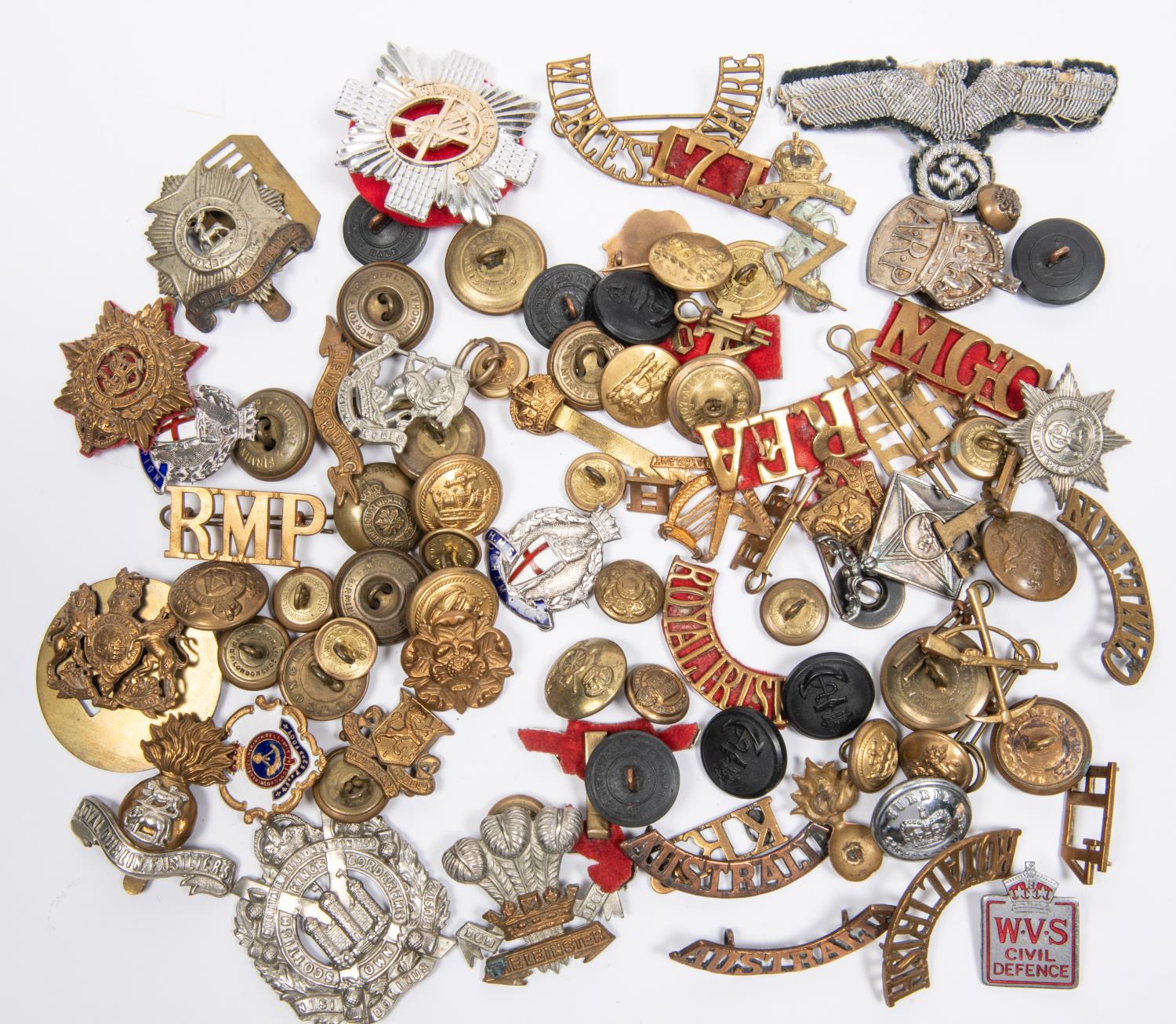 A small quantity of military badges, buttons, etc, including cap badges of the Royal Dublin