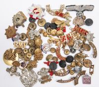 A small quantity of military badges, buttons, etc, including cap badges of the Royal Dublin