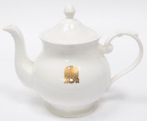 A Third Reich china teapot and lid, marked with a gilt eagle and swastika flanked by "AH", made by