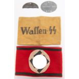 A Third Reich SS Kampfbinde felt armband; a black on khaki linen printed armband "Waffen SS"; half a