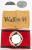 A Third Reich SS Kampfbinde felt armband; a black on khaki linen printed armband "Waffen SS"; half a