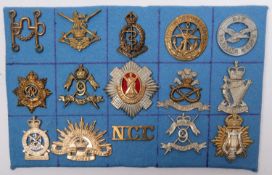 Thirteen cap badges, including cast brass 9th Lancers (AF), Royal Scots, United Services Corps,