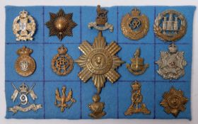 Fourteen cap badges, including Victorian 7th Hussars, 9th Lancers, post 1931 14/20th Hussars, and