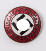 A Third Reich NSDAP brass and enamel party badge. GC £20-30