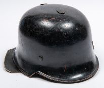 A late WWII or post war German Fire Service helmet, similar to M1935 helmet with leather neck