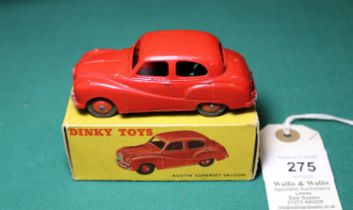 Dinky Toys Austin Somerset Saloon (161). An example in red with red wheels and black rubber tyres.