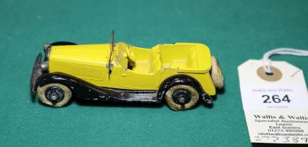 A rare Dinky Toys Sports Tourer Four Seater (24g). Bright yellow body with spare wheel carrier to