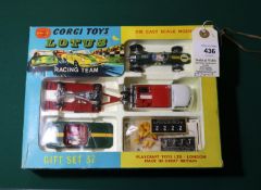 A Corgi Toys Gift Set 37 "Lotus Racing Team". Comprising a Lotus Climax Racing Car in BRG with