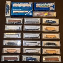 A quantity of 'N' gauge Freight Rolling Stock by KATO, Tomix and Trix. 3x Bogie Tank Wagons. 9x