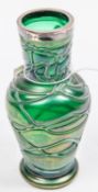 Loetz Glass vase with unmarked white metal rim. Lovely Emarald green colour with iridescent look. No