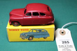 Dinky Toys Standard Vanguard (153). A scarce example in maroon with maroon ridged wheels and black