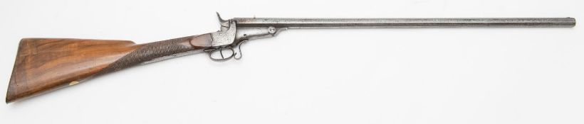 A 7mm rim fire saloon or garden gun, tip down octagonal twist barrel 25¾", B'ham proved, with scroll