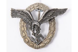 A Third Reich Luftwaffe Pilot's badge, with matt silver wreath and black eagle, the reverse with