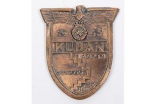 A Third Reich 1943 Kuban Shield, with copper washed finish, 4 band over blades, and steel backing