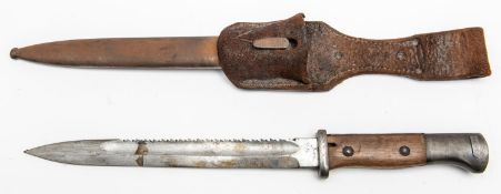 A German M1884/98 bayonet, saw back blade 10" with incomplete Solingen maker's name, the hilt with