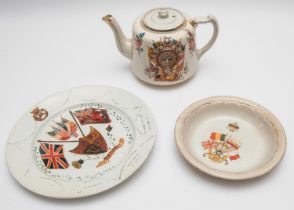 A patriotic teapot celebrating the end of WWI, decorated with flags of the allies, heads of allied