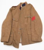 A WWI Belgian ORs service dress jacket, red piped collar and shoulder straps, blue collar patches,