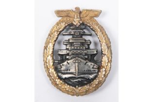 A Third Reich High Seas Fleet War badge, grey with gilt wreath, the reverse marked "FEC. ADOLF BOCK/