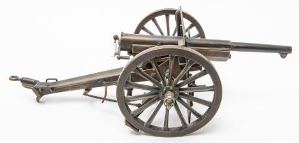 A good oxidised brass model of a French 75mm Field Gun, 11" overall, with opening breech,