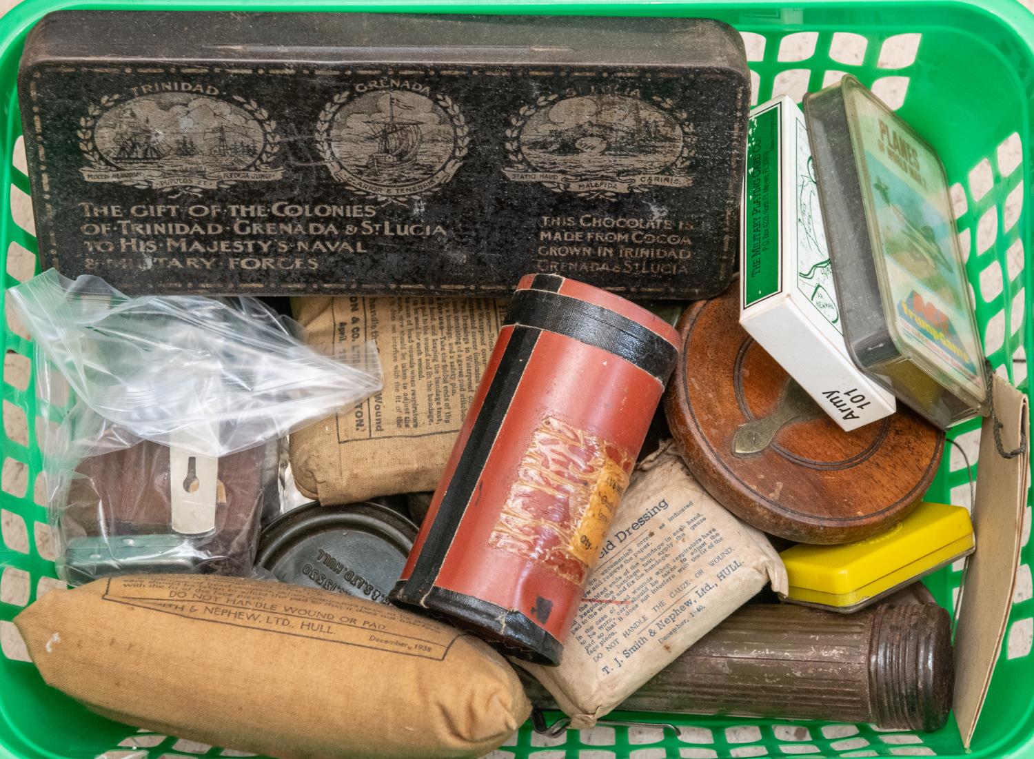 A wood and brass fishing reel, diameter 4", and a small brass one diameter 2"; a pewter hip flask; a