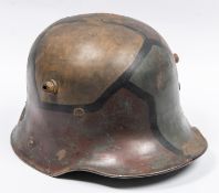 An Imperial German M1916 steel helmet, with original geometric camouflage paint finish, leather