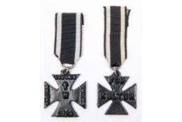 A British made WWI propaganda "Iron Cross", of black painted cast iron embossed on both sides with