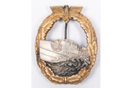 A Third Reich first pattern E Boat War badge, of heavy white metal construction, with silver boat on