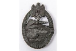 A Third Reich Panzer Assault badge, of grey metal with slightly concave back, partly fretted out