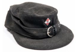 A Third Reich black cloth peaked field cap of the Hitler Youth, with embroidered badge and alloy