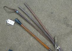 2 British Army officers' brown leather covered swagger sticks, a weighted end malacca cosh, also a