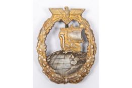 A Third Reich Auxiliary Cruiser War badge, with grey globe, gilt ship and wreath, and flat grey