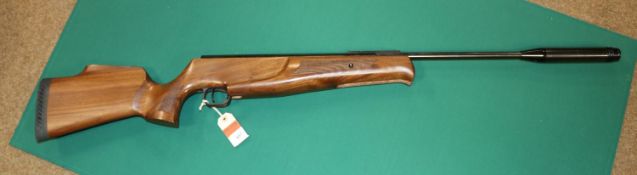 ** A .25" Theoben break action air rifle, number TB 19706, with telescopic sight grooves and sound