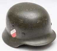 A Third Reich M1936 steel helmet army model, field grey with both decals, leather lining and chin